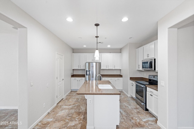 12727 W Lowden Rd, Peoria, AZ 85383 - kitchen with appliances with stainless steel finishes, a sink, white cabinetry, recessed lighting, and a kitchen island with sink
