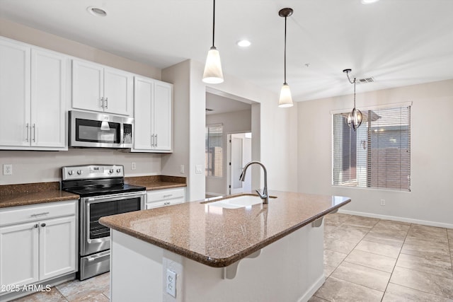 12727 W Lowden Rd, Peoria, AZ 85383 - kitchen with appliances with stainless steel finishes, a sink, dark stone counters, white cabinetry, and recessed lighting