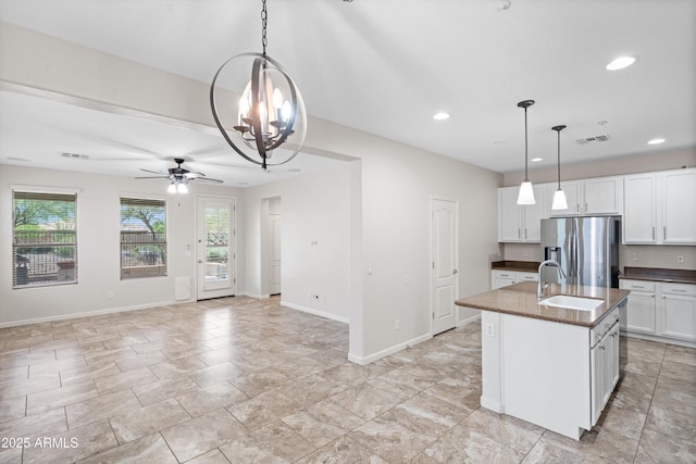 12727 W Lowden Rd, Peoria, AZ 85383 - kitchen with stainless steel refrigerator with ice dispenser, a sink, a chandelier, a ceiling fan, and white cabinets