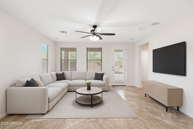 12727 W Lowden Rd, Peoria, AZ 85383 - living area featuring a ceiling fan and baseboards