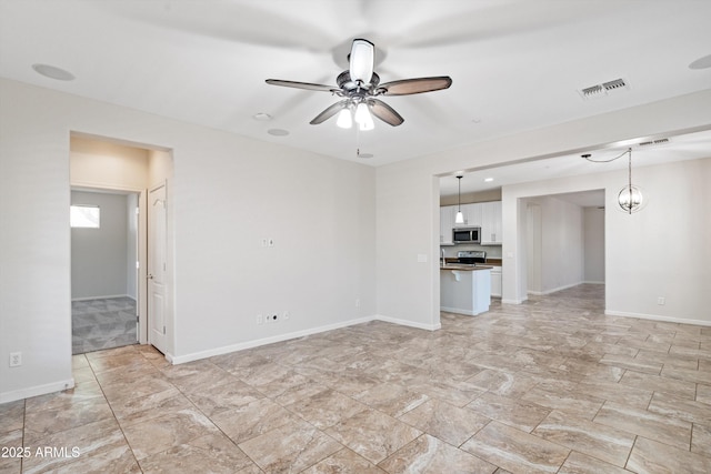 12727 W Lowden Rd, Peoria, AZ 85383 - unfurnished living room with a ceiling fan and baseboards