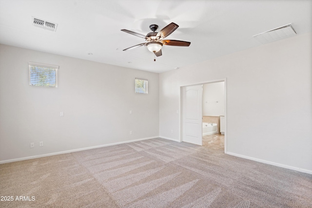 12727 W Lowden Rd, Peoria, AZ 85383 - spare room with a ceiling fan, light colored carpet, and baseboards