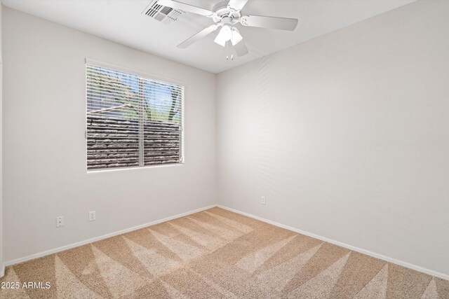 12727 W Lowden Rd, Peoria, AZ 85383 - unfurnished room with light carpet, ceiling fan, and baseboards