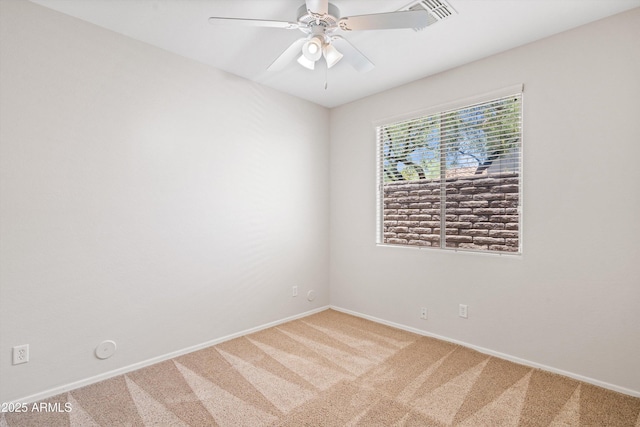 12727 W Lowden Rd, Peoria, AZ 85383 - spare room with light colored carpet, a ceiling fan, and baseboards