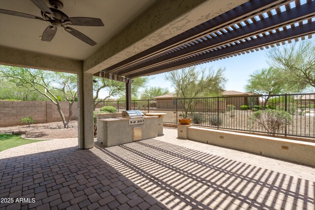 12727 W Lowden Rd, Peoria, AZ 85383 - fenced backyard with an outdoor kitchen, a ceiling fan, a patio area, and a pergola