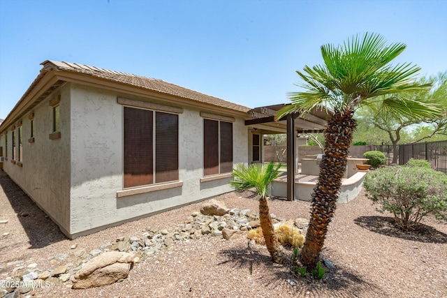 12727 W Lowden Rd, Peoria, AZ 85383 - view of property exterior with stucco siding and a patio area