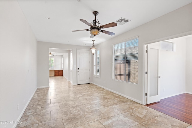 12727 W Lowden Rd, Peoria, AZ 85383 - unfurnished room featuring a ceiling fan and baseboards