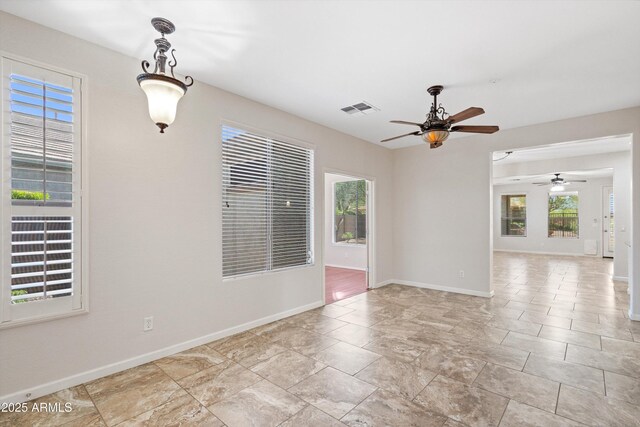 12727 W Lowden Rd, Peoria, AZ 85383 - spare room featuring a ceiling fan and baseboards