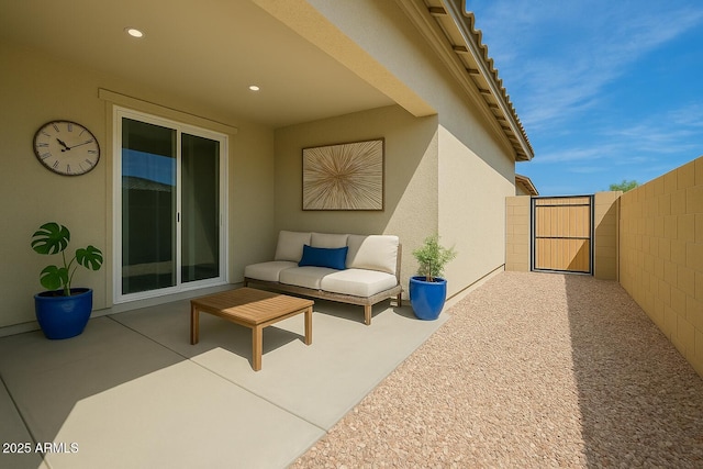 view of patio / terrace with fence and a gate