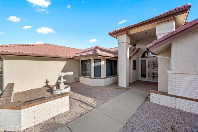 property entrance with a patio area