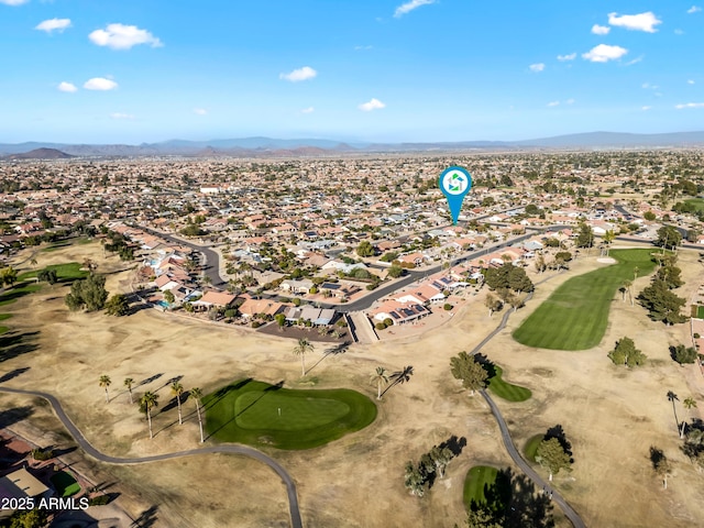 birds eye view of property featuring a mountain view