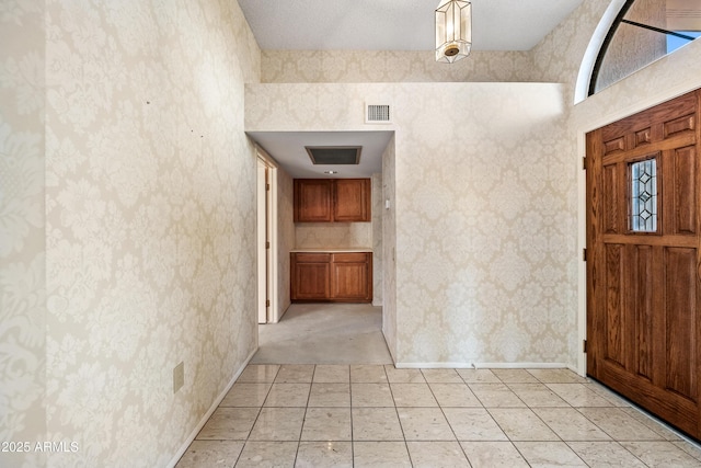 foyer entrance featuring a high ceiling