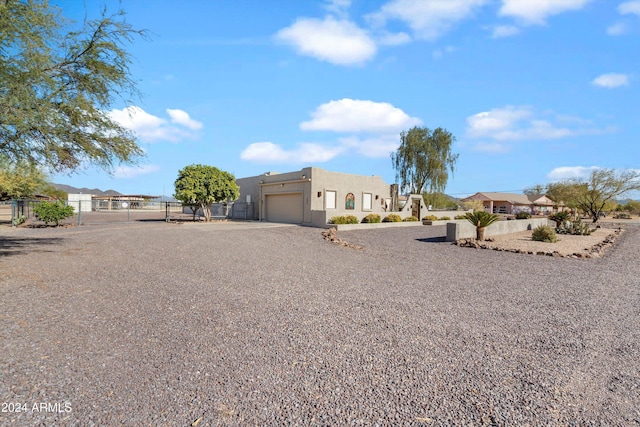 southwest-style home with a garage