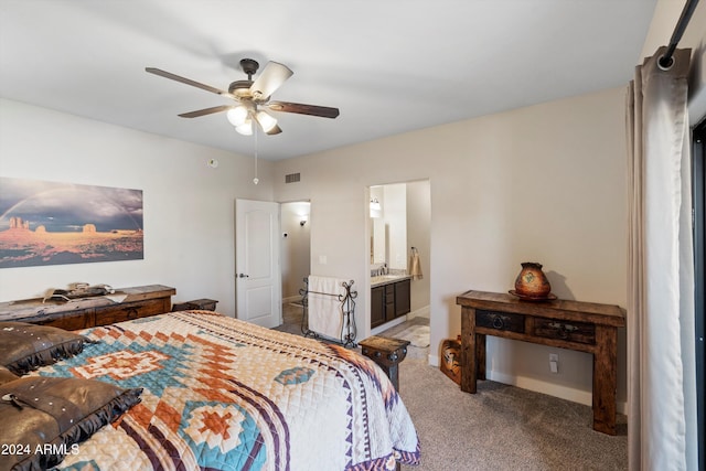 carpeted bedroom featuring connected bathroom and ceiling fan