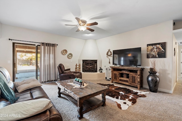 carpeted living room featuring ceiling fan