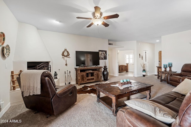 living room featuring light colored carpet and ceiling fan