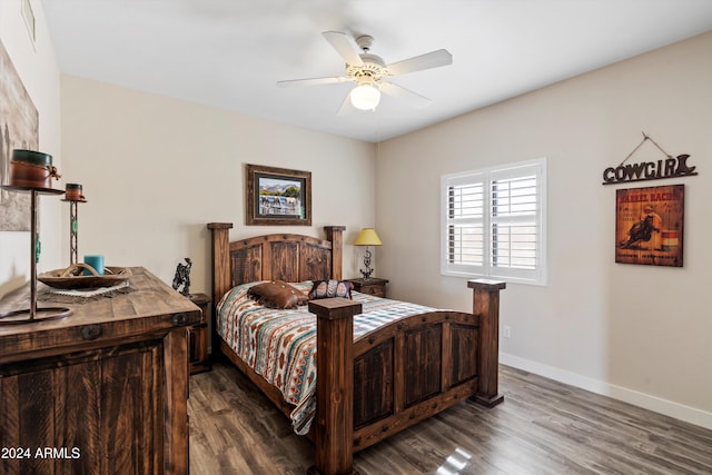 bedroom with ceiling fan and dark hardwood / wood-style flooring