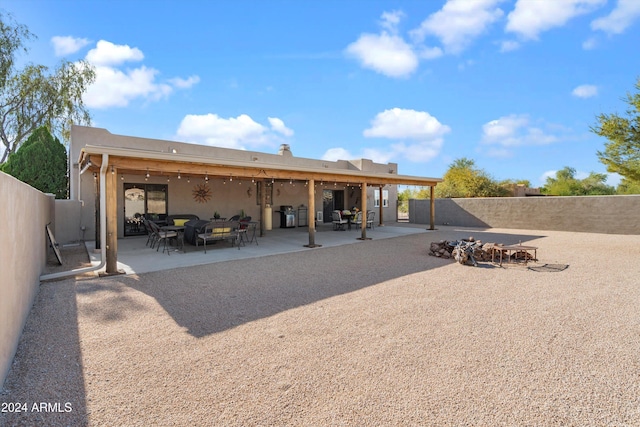 back of house with a patio area