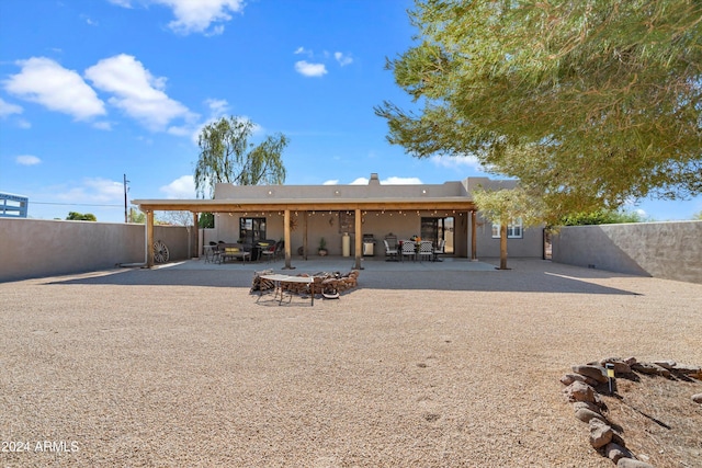 back of house with a patio area