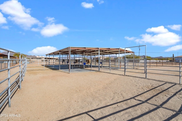 view of stable featuring a rural view