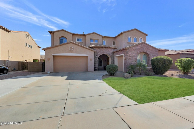 mediterranean / spanish house featuring a front yard