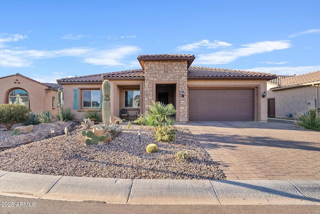 mediterranean / spanish-style home featuring a garage