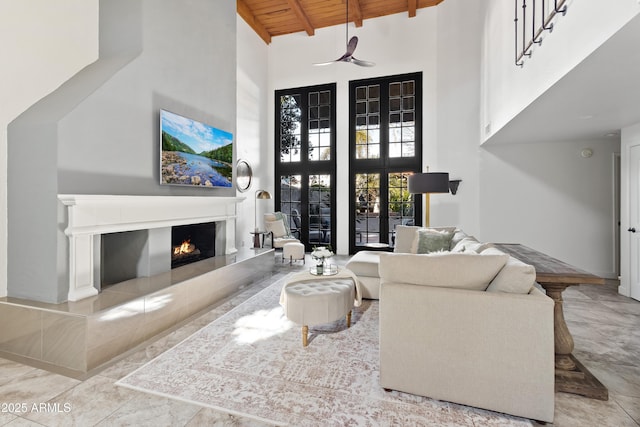 living room featuring high vaulted ceiling, wooden ceiling, and beam ceiling