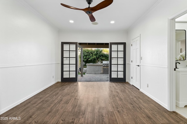 interior space featuring sink, dark hardwood / wood-style flooring, ceiling fan, and french doors