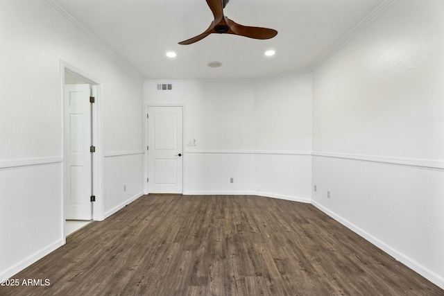 empty room with ceiling fan, ornamental molding, and dark hardwood / wood-style floors