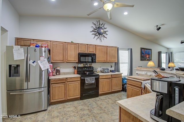 kitchen featuring vaulted ceiling, ceiling fan, and black appliances