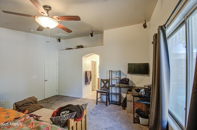 living room with light carpet and ceiling fan