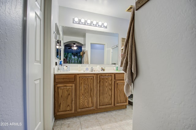 bathroom with tile patterned flooring and vanity