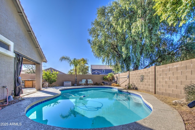 view of pool featuring a hot tub