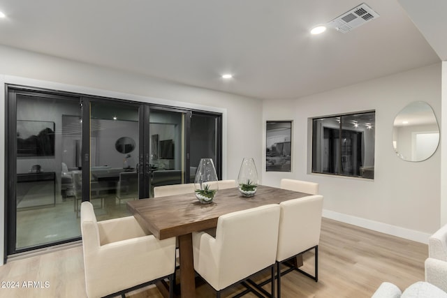 dining space featuring light wood-type flooring