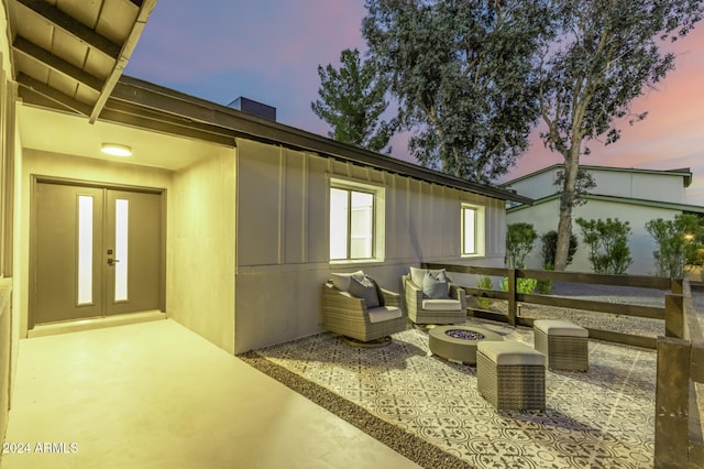 exterior space with a fire pit and french doors