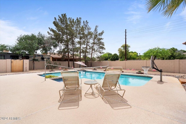 view of swimming pool featuring a fenced in pool, a patio area, and a fenced backyard