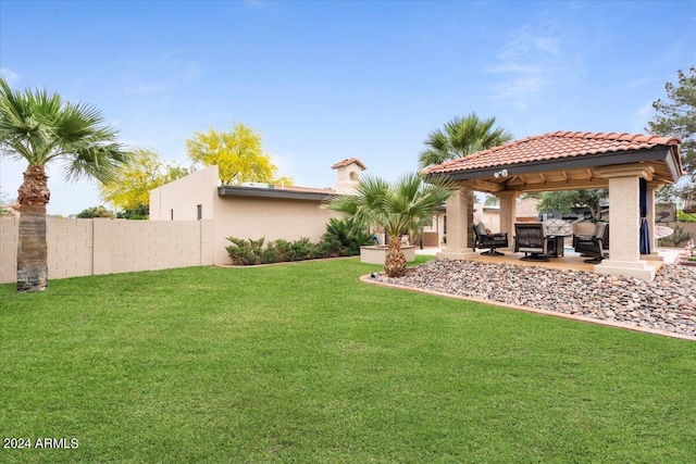 view of yard featuring fence, a gazebo, and a patio