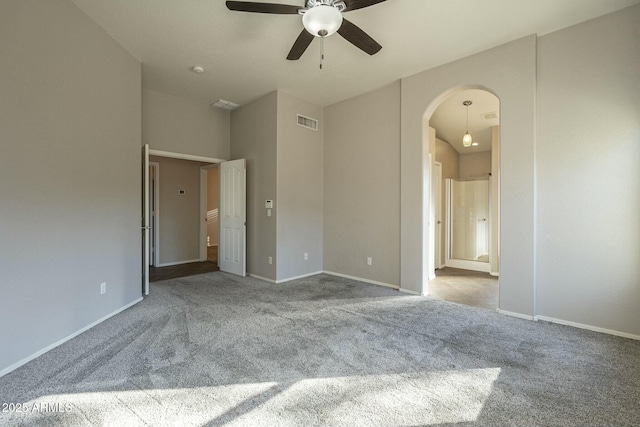 unfurnished bedroom featuring connected bathroom and light carpet