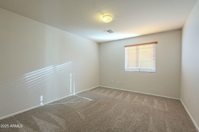 unfurnished room featuring carpet floors