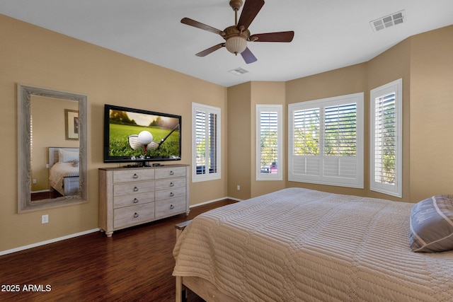 bedroom featuring dark wood-style floors, visible vents, multiple windows, and baseboards
