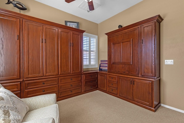 sitting room with a ceiling fan, vaulted ceiling, carpet floors, and baseboards