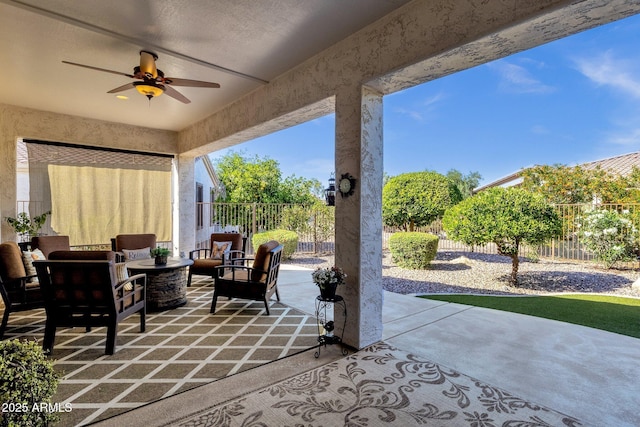 view of patio / terrace with outdoor lounge area, a fenced backyard, and a ceiling fan