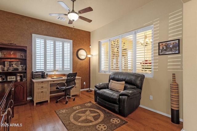 office area featuring a ceiling fan, visible vents, hardwood / wood-style floors, and baseboards