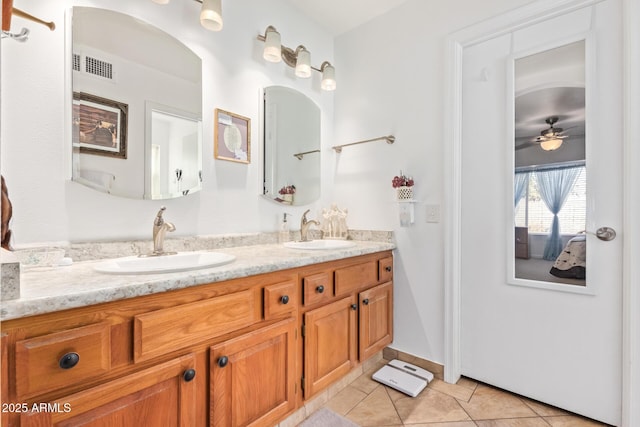 full bathroom with tile patterned flooring, visible vents, a sink, and double vanity