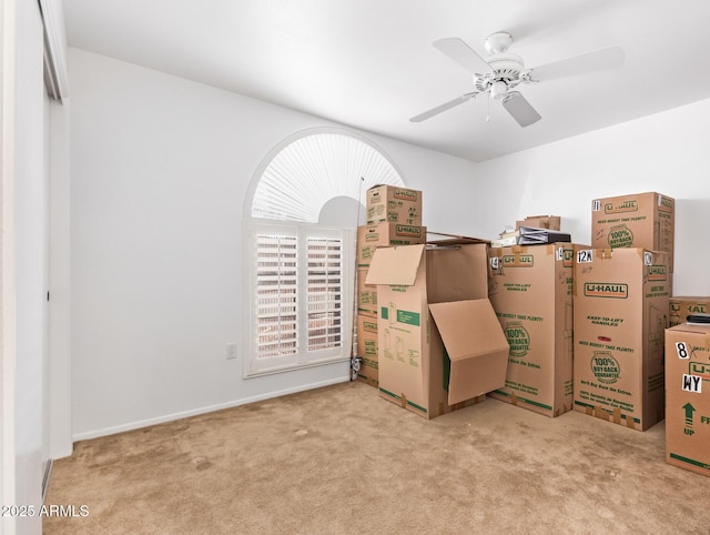 interior space with ceiling fan