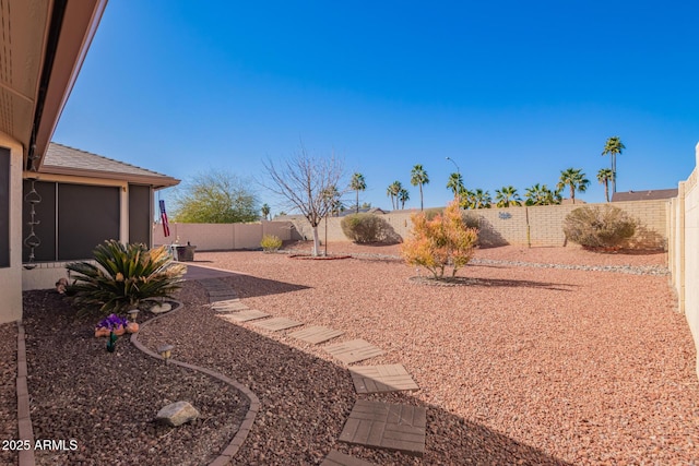 view of yard with a fenced backyard and a patio