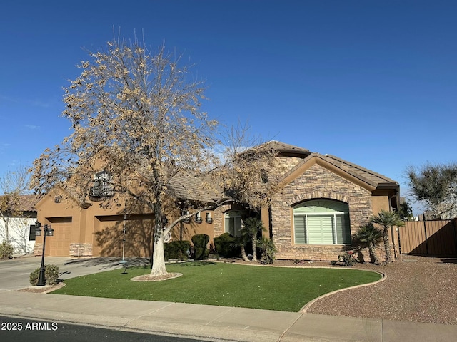 view of front of house featuring a garage and a front yard