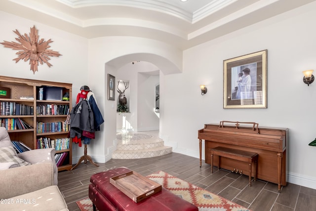 sitting room featuring crown molding and a tray ceiling