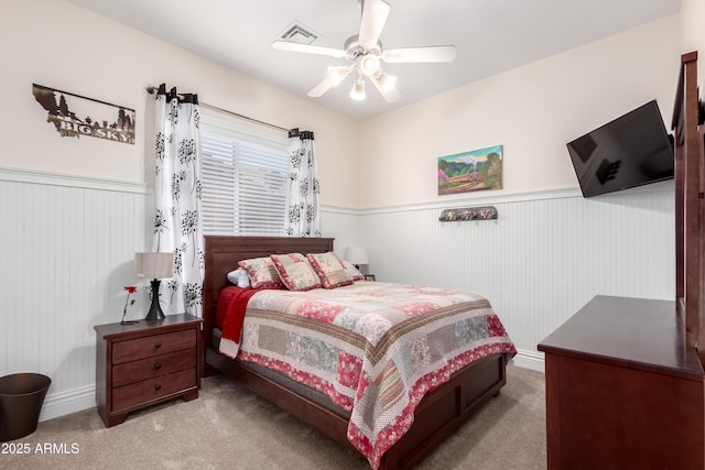 bedroom featuring light colored carpet and ceiling fan