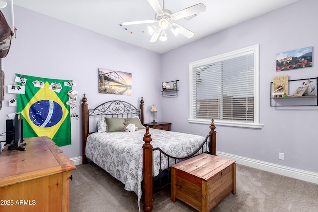 bedroom featuring ceiling fan and dark colored carpet